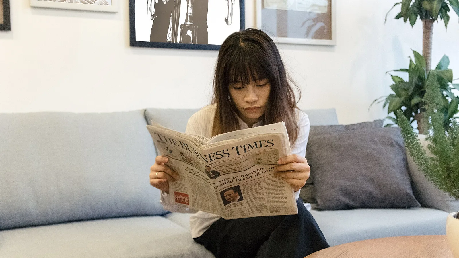 Business Woman is reading Newspaper 35870943420